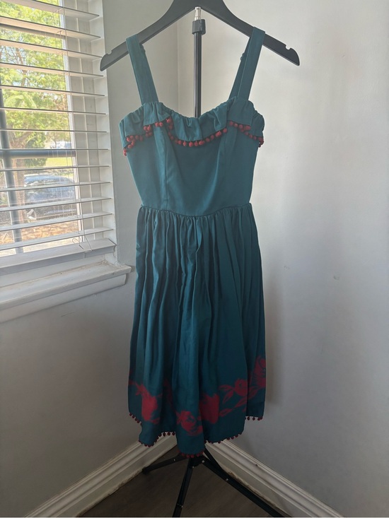 Pinup Couture Dresses & Skirts - Pinup Couture Teal Sundress with Red Pom Trim and Floral Hem
